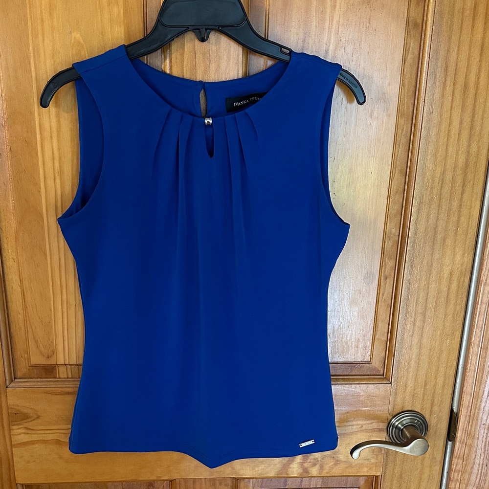 Ivanka Trump blue sleeveless blouse